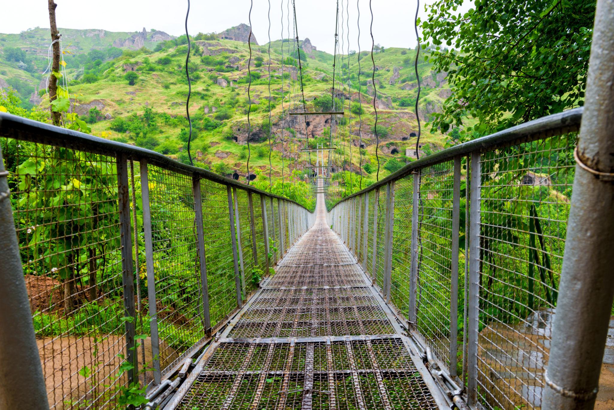 POV crossing the 700 m suspension bridge over Khndzoresk Gorge