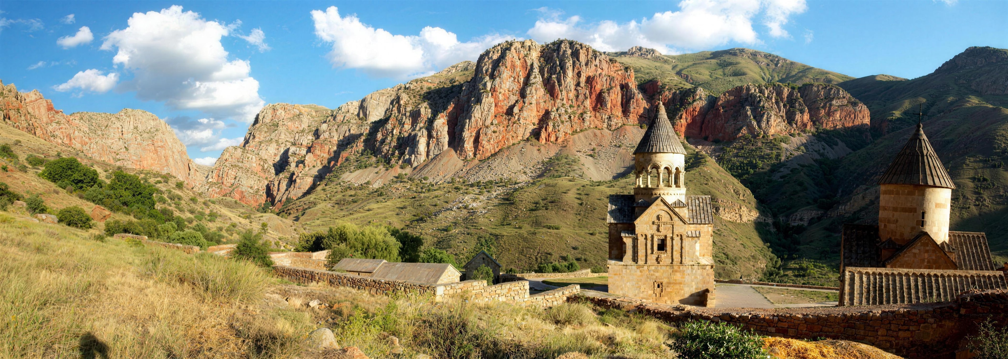 Panorama of Noravank monastery before red cliffs in Vayots Dzor