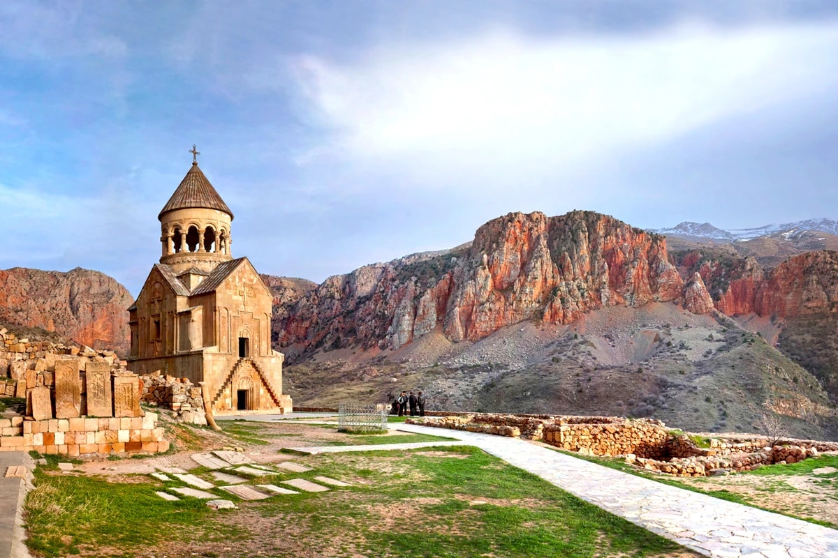 Noravank monastery beneath the red cliffs of the Amaghu gorge in Vayots Dzor
